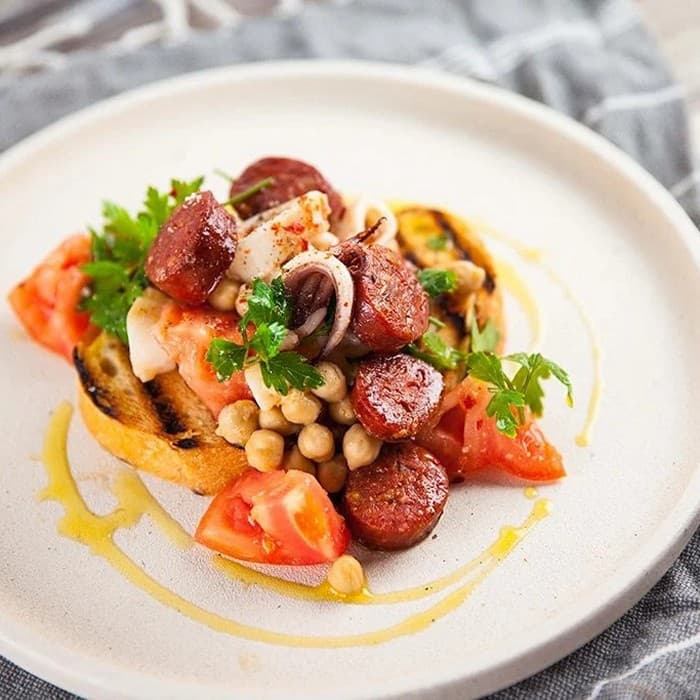 Source photograph of Squid, chickpea & chorizo salad
