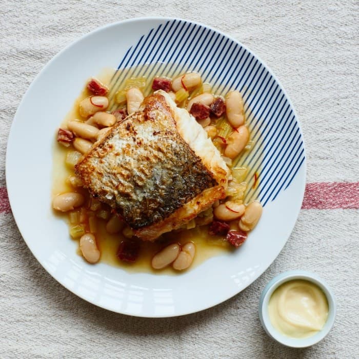 Source photograph of Pan-fried hake, white bean & chorizo broth