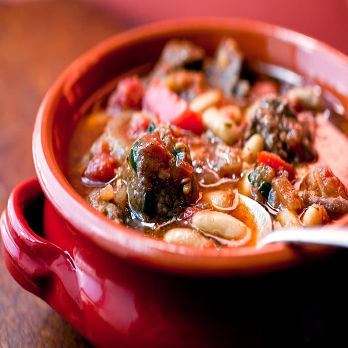 Source photograph of Spanish-style slow-cooked lamb shoulder & beans