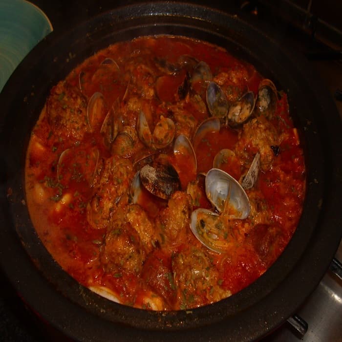 Source photograph of Spanish meatballs with clams, chorizo & squid