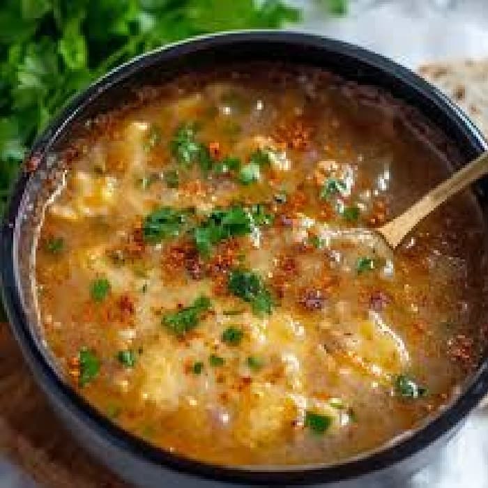 Source photograph of Chorba Hamra bel Frik (Algerian Lamb, Tomato, and Freekeh Soup)