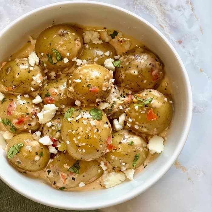 Source photograph of Papas Chorreadas Recipe (Potatoes with Cream and Cheese Sauce)